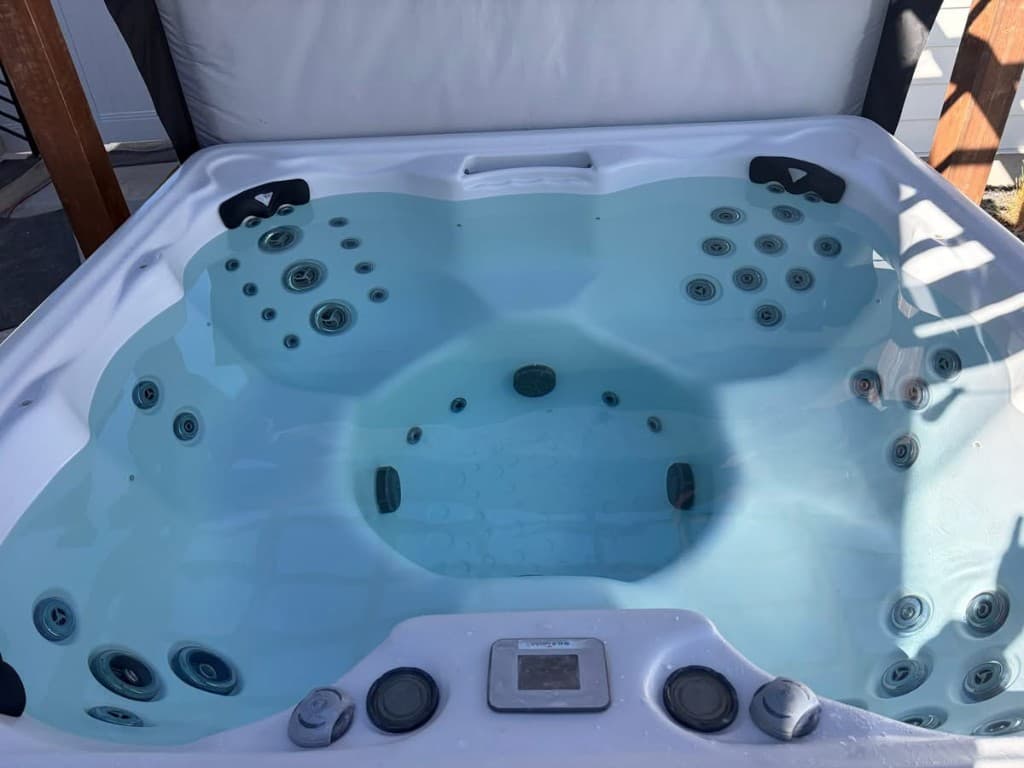 After: crystal clear hot tub water 24 hours later — no drain or refill, only professional chemical recovery by Quality Spa Care